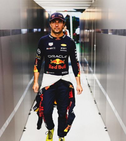 SINGAPORE, SINGAPORE - SEPTEMBER 17: Sergio Perez of Mexico and Oracle Red Bull Racing walks in the garage prior to the F1 Grand Prix of Singapore at Marina Bay Street Circuit on September 17, 2023 in Singapore, Singapore. (Photo by Mark Thompson/Getty Images) // Getty Images / Red Bull Content Pool // SI202309170197 // Usage for editorial use only //